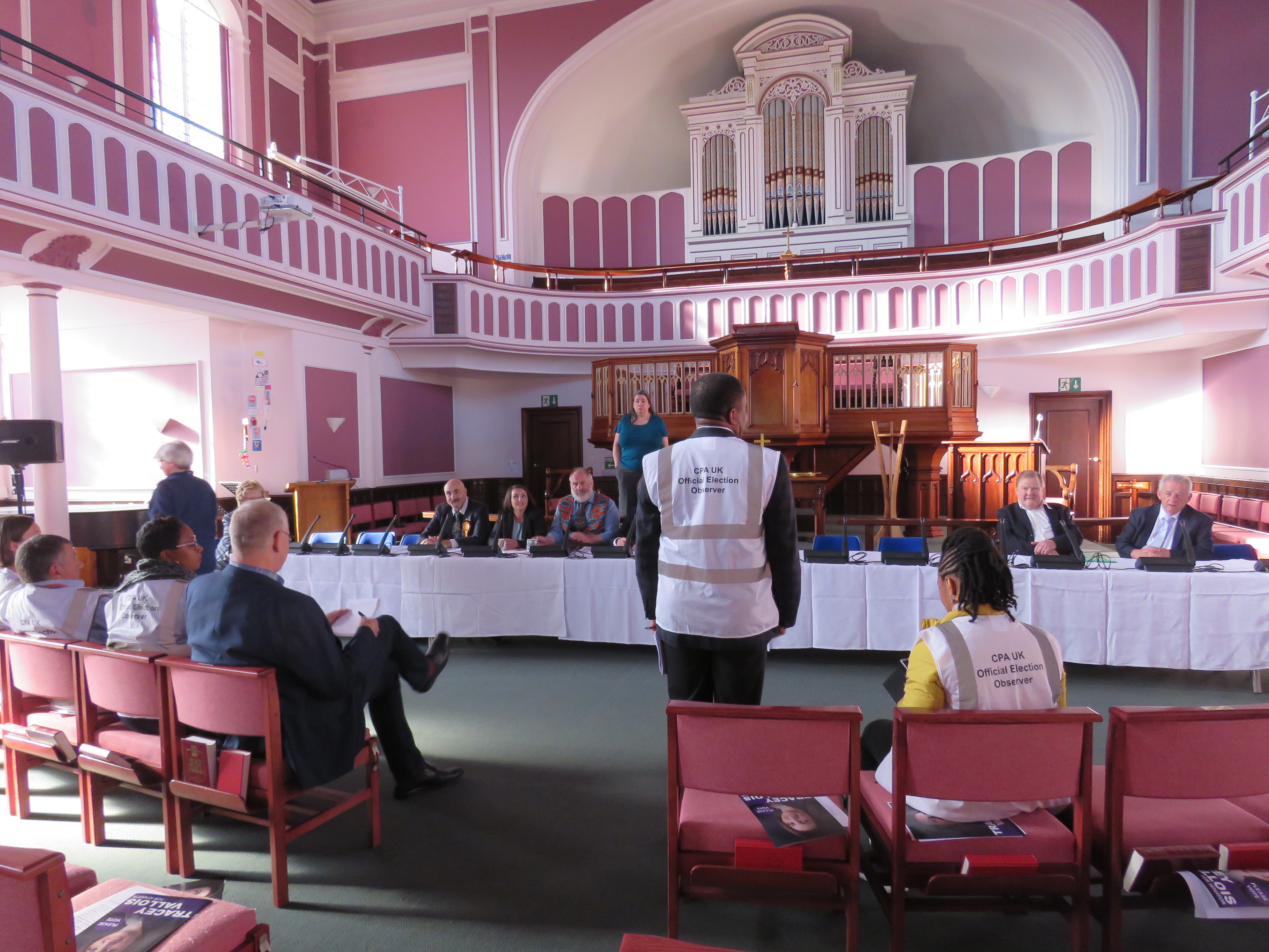 Observers meeting with senatorial candidates before a hustings.