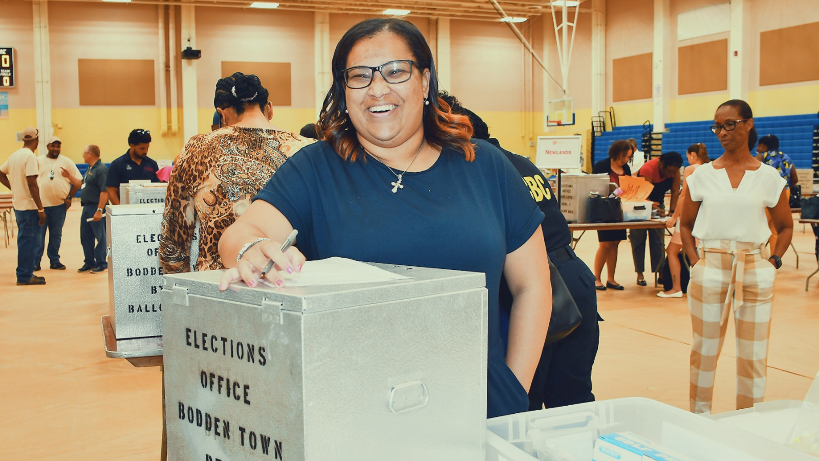 A member of polling station staff at the Cayman Islands General Election June 2021