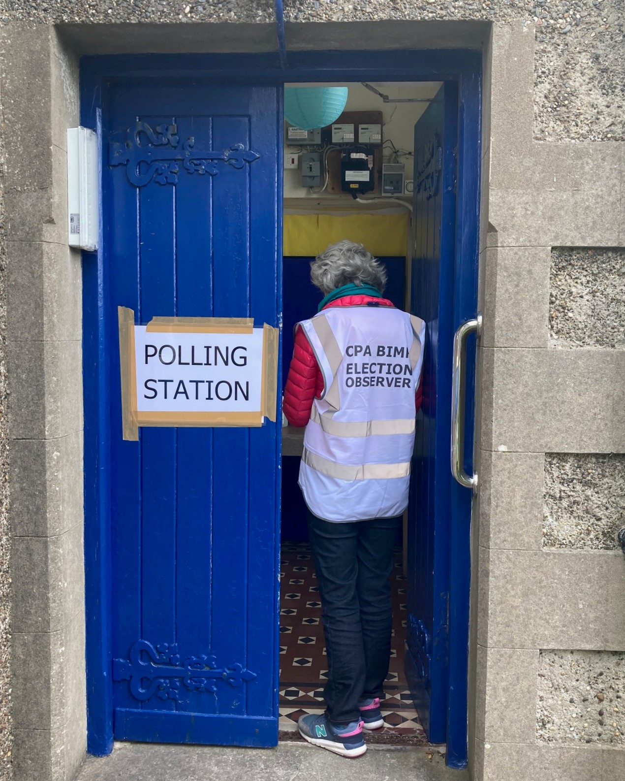 An international observer at a polling station in Garff, Isle of Man.