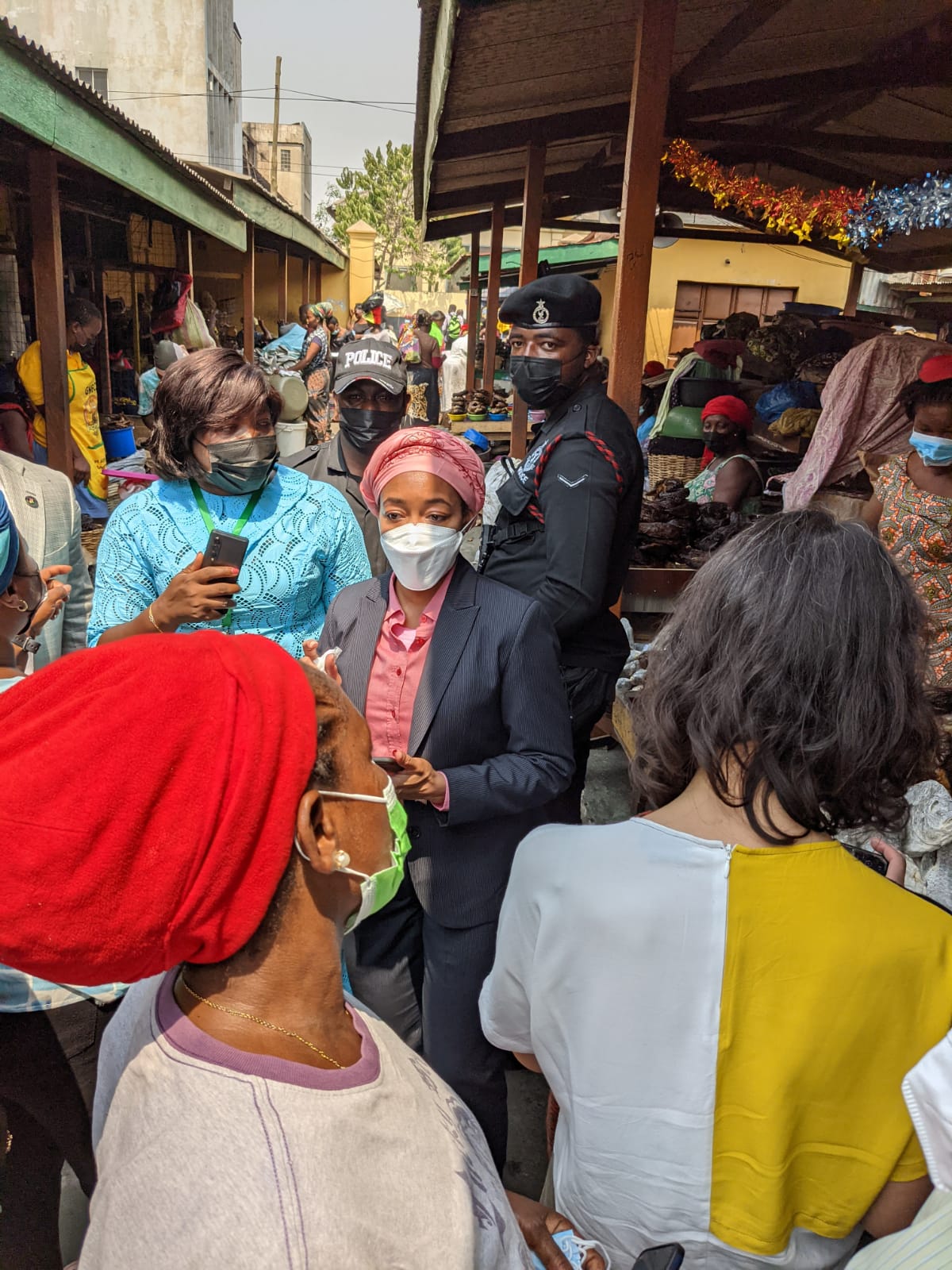 Delegates visit women traders at a market in Accra