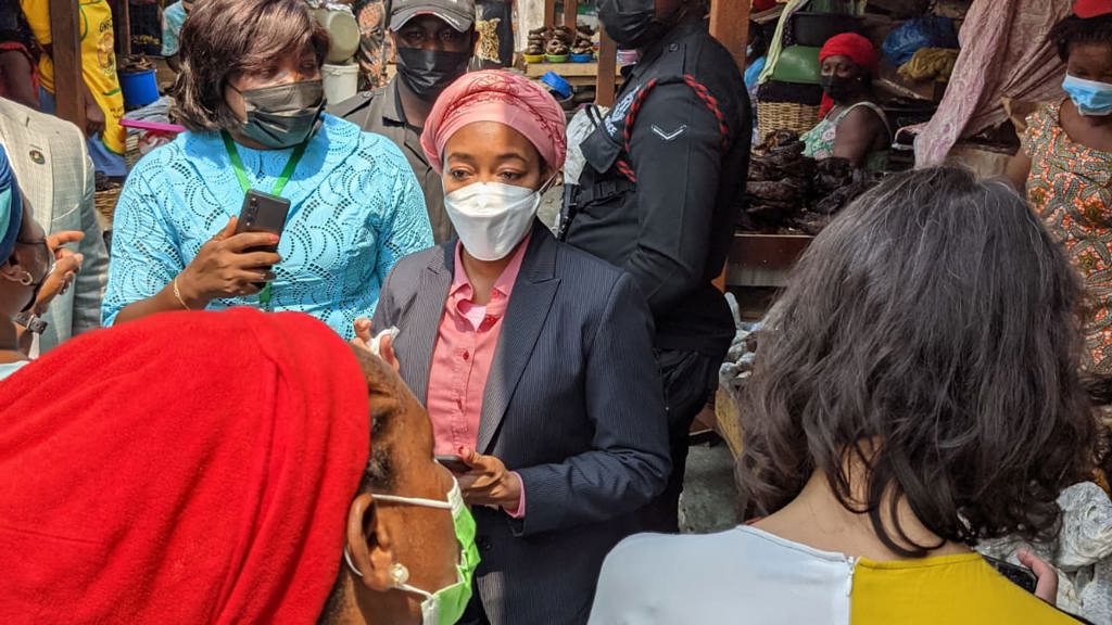 Delegates visit women traders at a market in Accra