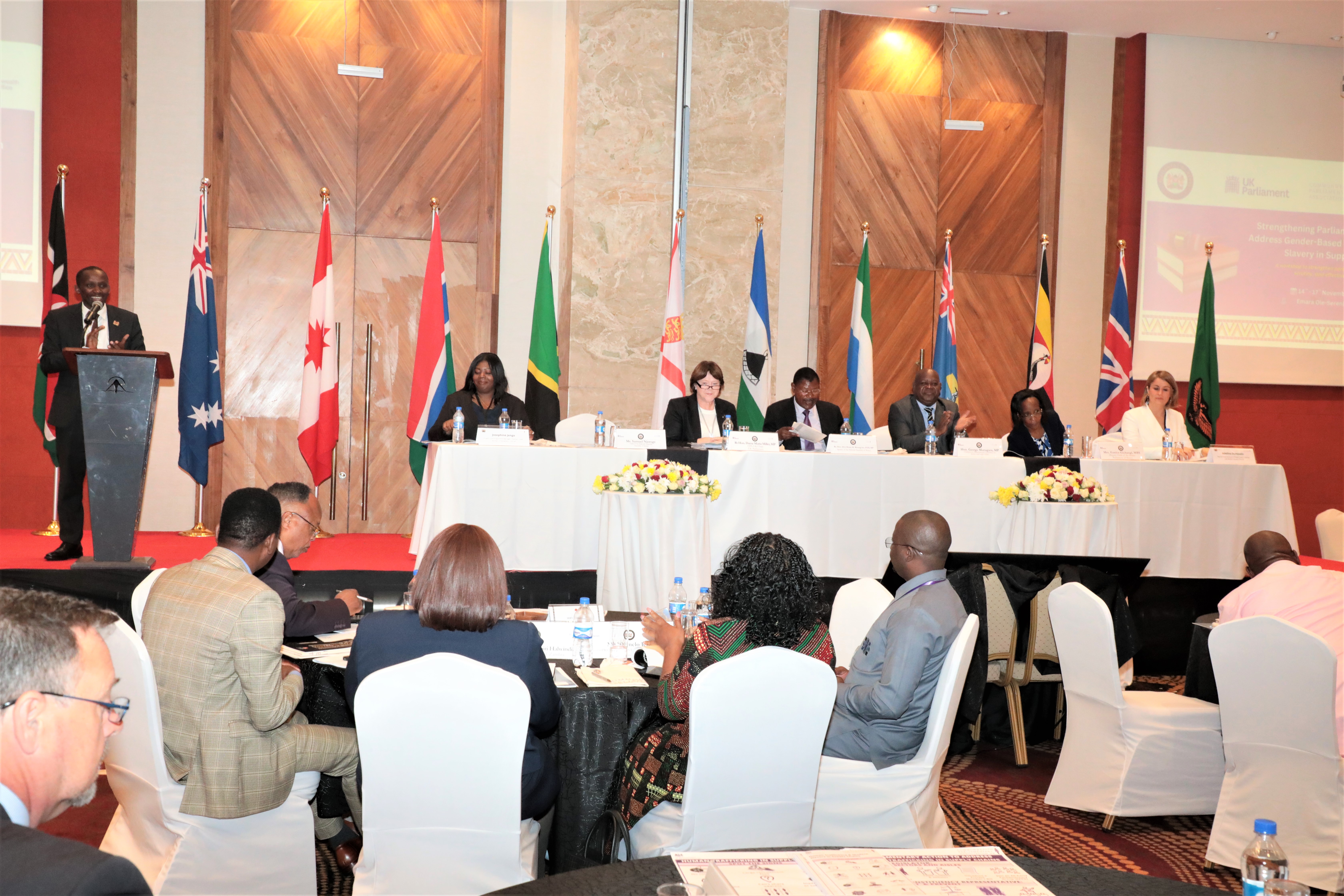 Delegates listen to remarks at the Opening Ceremony