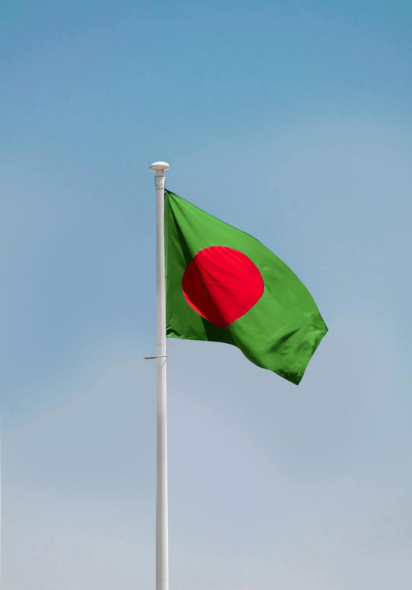 Bangladesh flag flying on a flag pole