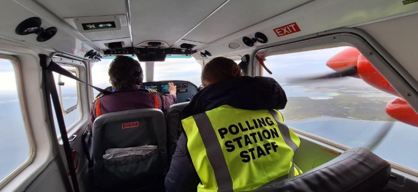 falkland islands polling station officer on a plane